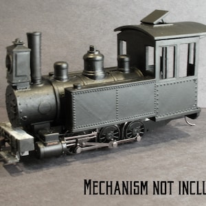 May include: Black model train locomotive with a cab and a Porter label.  Mechanism not included.