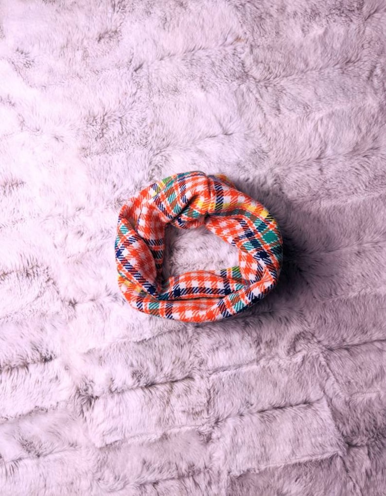 A simple scarf that slips over your pets head. A fashion statement. Many colors to choose from. This is a vintage bright orange and blue and green plaid pattern.