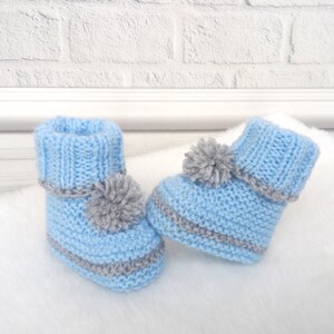 Knitted baby boots with pompoms New born baby shoes Infant booties Baby shower gift Pompom booties