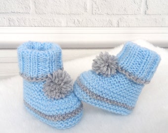 Knitted baby boots with pompoms New born baby shoes Infant booties Baby shower gift Pompom booties