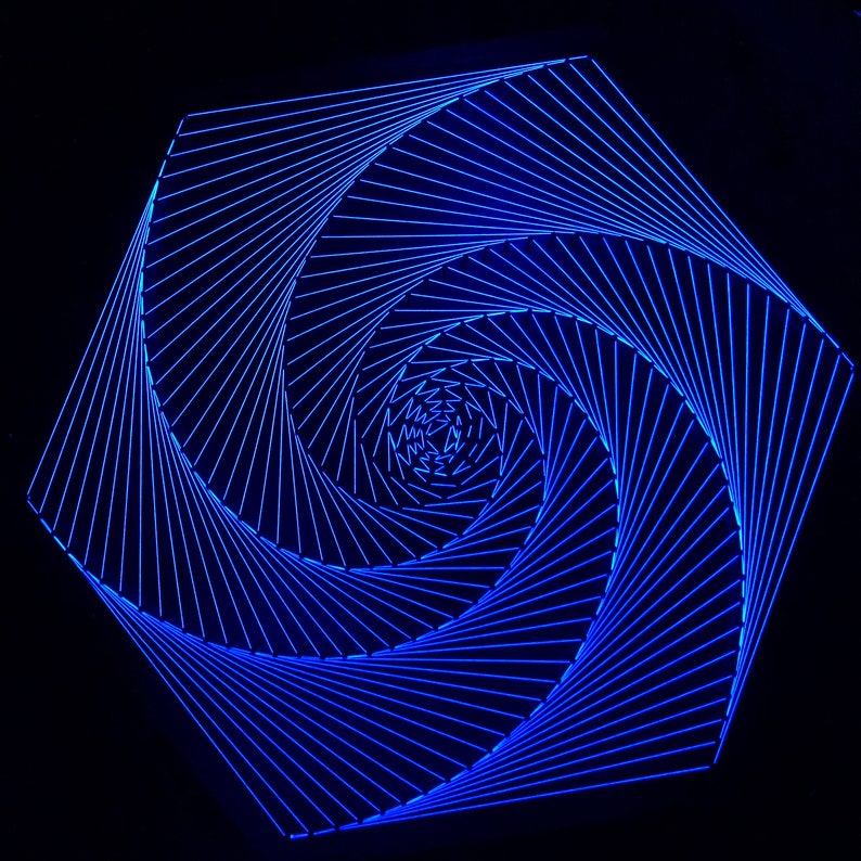 May include: A blue geometric design with a spiral pattern. The design is made up of thin lines that create a hypnotic effect.