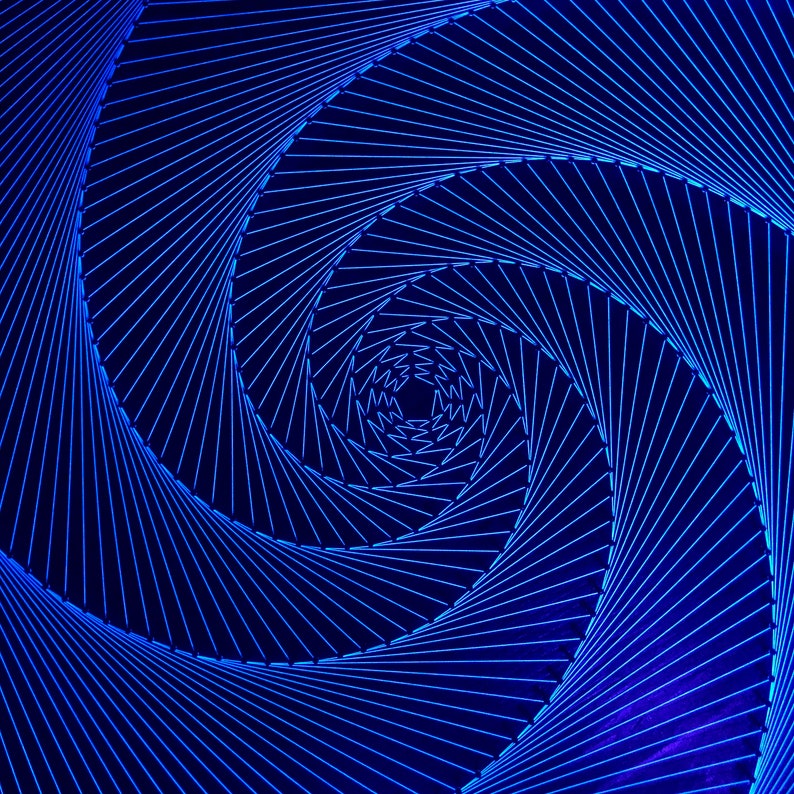 May include: Abstract blue and black geometric pattern with a swirling design. The pattern is created with thin lines that create a sense of depth and movement.