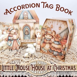May include: An accordion tag book with a Christmas theme. The cover features a house illustration with a mouse character. The book is titled "Accordion Tag Book" and "Little Mouse House at Christmas". The image includes the text "Please wipe your paws".