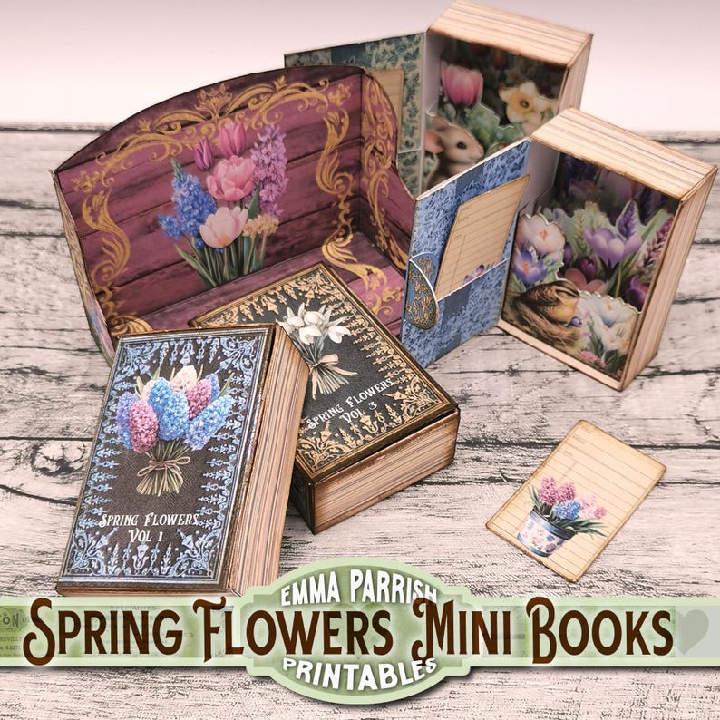 May include: Three miniature books with spring flower designs. The books are made of wood and have a vintage look. The covers feature illustrations of hyacinths, white flowers, and crocuses. The books are titled "Spring Flowers Vol. 1", "Spring Flowers Vol. 3", and "Spring Flowers Vol. 2".