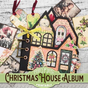 May include: Printable Christmas house album with a festive design. The album features a house with a clock, a door, and windows. The house is decorated with holly, bells, and a snowman. The album is titled "Christmas House Album" and "Printable".