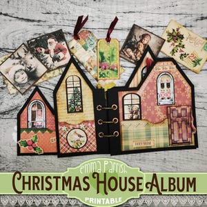 May include: A printable Christmas house album with a red and green color scheme. The album is decorated with various Christmas-themed images, including Santa Claus, a Christmas tree, and a holly sprig. The album is titled "Christmas House Album" and has the words "Emma Parrish" and "Printable" printed on it.
