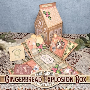 Puede incluir: Una caja explosiva de pan de jengibre con un diseño en forma de casa, con ilustraciones navideñas. La caja está abierta, revelando múltiples paneles con hombres de jengibre, acebo y gráficos de regalos. El texto "Merry Christmas" es visible.