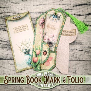 May include: Printable spring-themed bookmark and folio set with floral designs, a ladybug, and the text "Blossom by blossom the spring begins" and "Never yet was a springtime when the buds forgot to bloom".