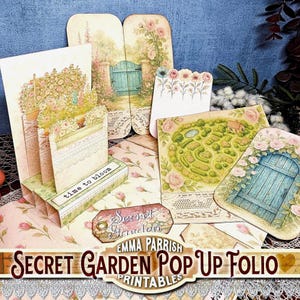 May include: A paper craft pop-up folio kit featuring floral and garden themes. Components include a multi-layered stand with the text time to bloom, a tag labelled Secret Garden, and various cards depicting rose bushes, a blue door, and a garden map.