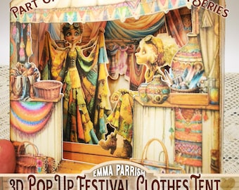 May include: A 3D pop-up festival clothes tent paper craft featuring the text Part of the Festival Fantasia Series and Emma Parrish 3D Pop Up Festival Clothes Tent Printables. The scene depicts two characters in a colorful tent with baskets.