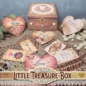 May include: A wooden treasure box with a heart-shaped design and a lock, surrounded by heart-shaped cards and decorative cards. The cards feature floral and vintage designs with phrases like "Keep" and "Love". The image includes the text "Little Treasure Box Printables".
