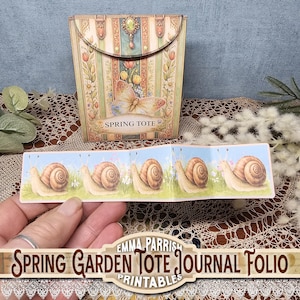 May include: A decorative spring-themed journal folio with a matching tote. The tote features a butterfly and floral design with the words "Spring Tote". The journal folio has a repeating pattern of snails on a blue background with grass and flowers.