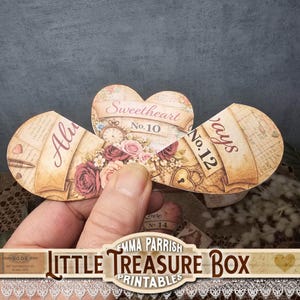 May include: A vintage-style paper heart with the words "Sweetheart No. 10" and "Always No. 12" printed on it. The heart is decorated with roses, a clock, and script. The bottom of the image has the text "Little Treasure Box Printables".