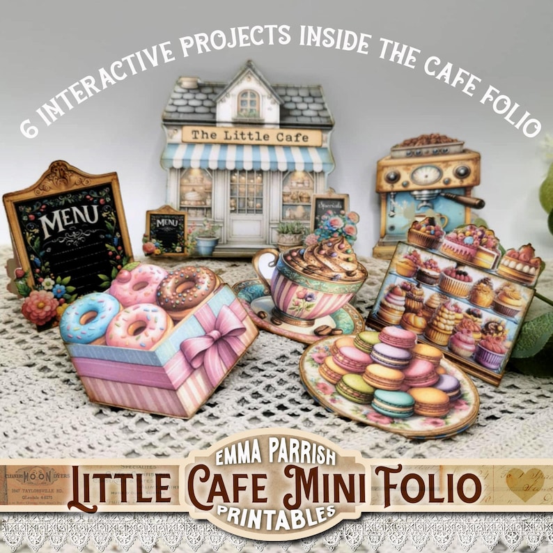 May include: A collection of miniature cafe-themed paper cutouts, including a cafe building, donuts, a coffee cup, and pastries. The set includes a menu board and the text "6 Interactive Projects Inside The Cafe Folio". The title "Little Cafe Mini Folio Printables" is also visible.