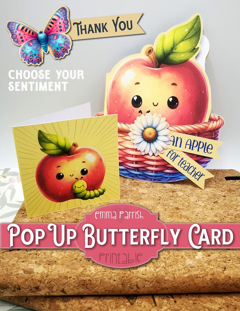 May include: Printable pop-up card featuring a red apple with a green leaf and a smiling face. The apple is in a basket with a white daisy and a banner that says "An Apple for Teacher". The card also includes a butterfly with blue and pink wings.
