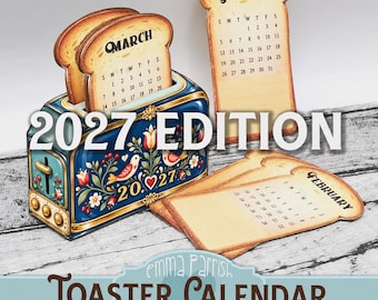 May include: A blue toaster-shaped calendar with floral patterns and the year 2027. It includes bread-shaped monthly inserts for January, February, and March. The text 2027 EDITION and TOASTER CALENDAR PRINTABLE by Emma Parrish is visible.