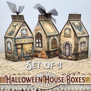 May include: A set of three Halloween house boxes, each with a different design: a witch, a ghost, and a bat. The boxes are decorated with pumpkins and the words "Trick & Treat". Each box has a black ribbon.
