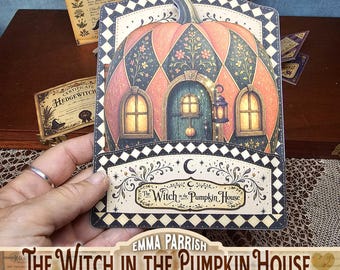May include: A decorative card featuring a pumpkin-shaped house with a teal door, glowing windows, and floral patterns. The border has a black and white diamond motif. Text on the card reads, The Witch in the Pumpkin House.