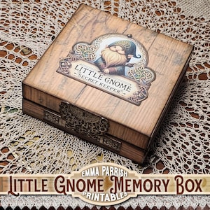 May include: A wooden memory box with a decorative label featuring a gnome illustration. The box has a metal clasp and is labeled "Little Gnome Secret Keeper". The box is made of wood with a light brown finish.
