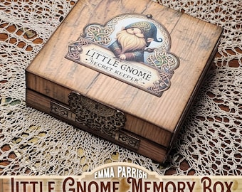 May include: A square wooden box with a light brown wood grain finish. The lid features an illustration of a gnome in a blue hat and the text "LITTLE GNOME SECRET KEEPER". The front has an ornate metal latch and decorative metal accents.