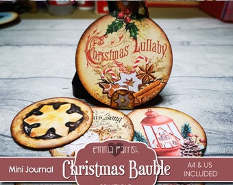 Pode incluir: Mini diário de Natal imprimível em forma de bola com uma variedade de designs, incluindo um biscoito de gengibre, um floco de neve, uma lanterna e uma árvore de Natal. As bolas são decoradas com azevinho, paus de canela e outros elementos festivos. O texto "Christmas Lullaby" aparece em uma das bolas.