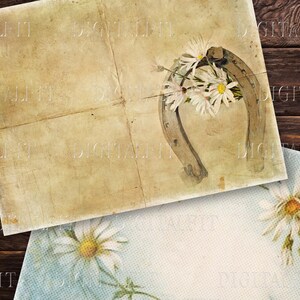 May include: A vintage-style image featuring a horseshoe with white daisies, on a textured, aged paper background. The image is perfect for crafting projects, scrapbooking, or adding a rustic touch to your designs.