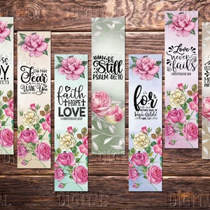 May include: Set of 8 printable bookmarks featuring floral designs and inspirational bible verses. The bookmarks are in shades of pink, white, and green with a watercolor effect. The verses include "Choose Joy", "Do Not Fear", "Faith Hope Love", "Where Be Still", "For With God", "Love Never Fails", and "Our Faith Can Move Mountains".