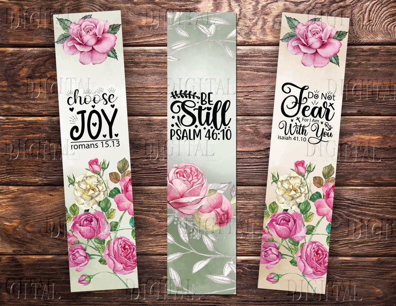 May include: Three floral bookmark designs with inspirational quotes. The first bookmark features a pink rose and the quote "choose joy romans 15.13". The second bookmark features a pink rose and the quote "be still psalm 46:10". The third bookmark features a pink rose and the quote "do not fear for i am with you isaiah 41:10".