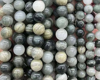 May include: A collection of round, smooth, gray and white gemstone beads. The beads have a marbled, striated pattern.