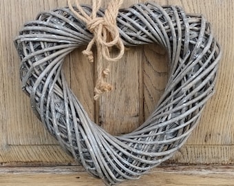 Grey washed wicker heart with hessian rope hanger