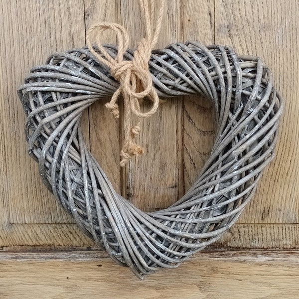 Grey washed wicker heart with hessian rope hanger