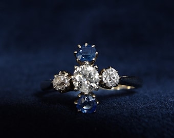 Antique Art Deco 18 ct. white gold 0.45 ct transitional cut diamond and natural old cut sapphire cross ring, made around 1930