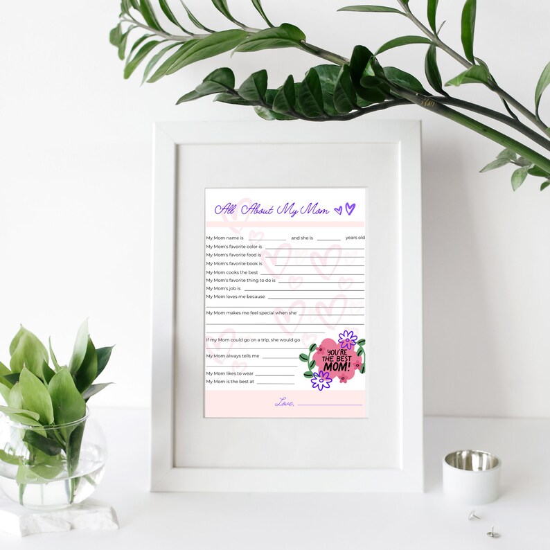 May include: A printable Mother's Day card with a pink and white background. The card has a fill-in-the-blank questionnaire about the person's mum. The text on the card reads "All About My Mum" and "You're the Best Mum!"