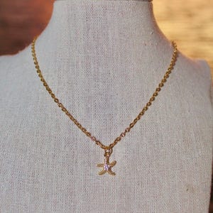 Collana con stella marina delicata in oro