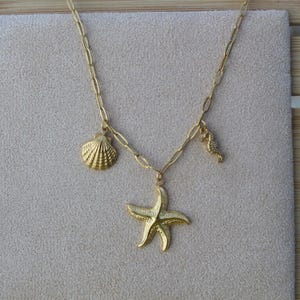 Collana con ciondolo spiaggia/mare in acciaio inossidabile dorato