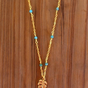 Blue & Gold Beaded Monstera Leaf Necklace