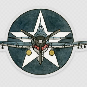 May include: A blue and white airplane sticker with a star in the background. The airplane is facing the viewer and has a red propeller.