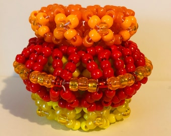 Red,orange, and yellow kandi rotator cuff