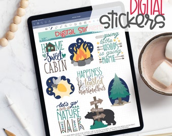 May include: A digital tablet screen displaying a set of 8 digital stickers with a camping theme. The stickers feature illustrations of a campfire, a cabin, a firefly, a pine tree, a bear, a signpost, and text that says "Home Sweet Cabin", "Happiness is toasted marshmallows", "Going to the woods is going home", and "Let's go on a nature walk".