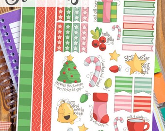 May include: Printable Christmas planner stickers featuring a variety of festive designs, including a Christmas tree, a stocking, a candy cane, a star, a bell, a wreath, and a mug with milk and cookies. The text "Ho ho ho this is where the presents go!" is included on the sticker sheet.