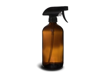 May include: A brown glass spray bottle with a black trigger sprayer. The bottle is empty and has a clear plastic tube running from the top to the bottom.