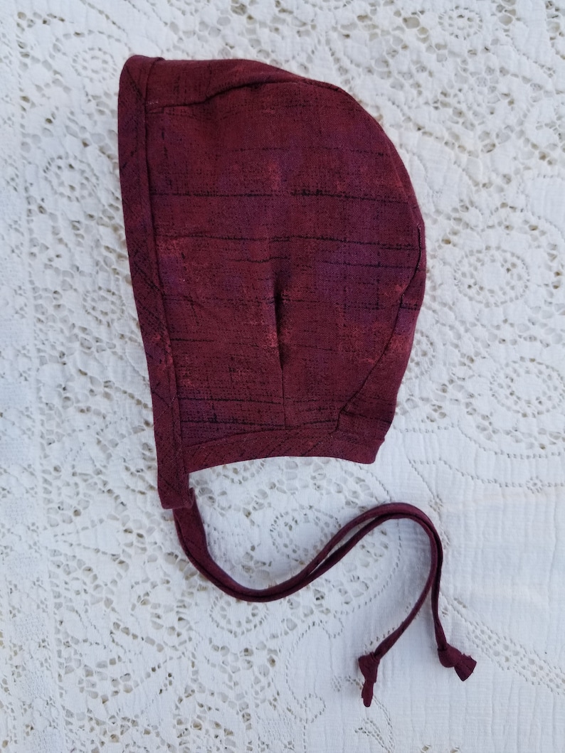 Reversible baby bonnet bugs