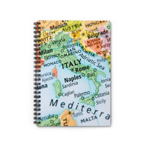 May include: A close-up of a map of Italy with the country highlighted in green. The map shows the major cities of Italy, including Rome, Naples, Milan, and Florence. The map also shows the surrounding countries, including France, Switzerland, Austria, Slovenia, Croatia, and Greece.