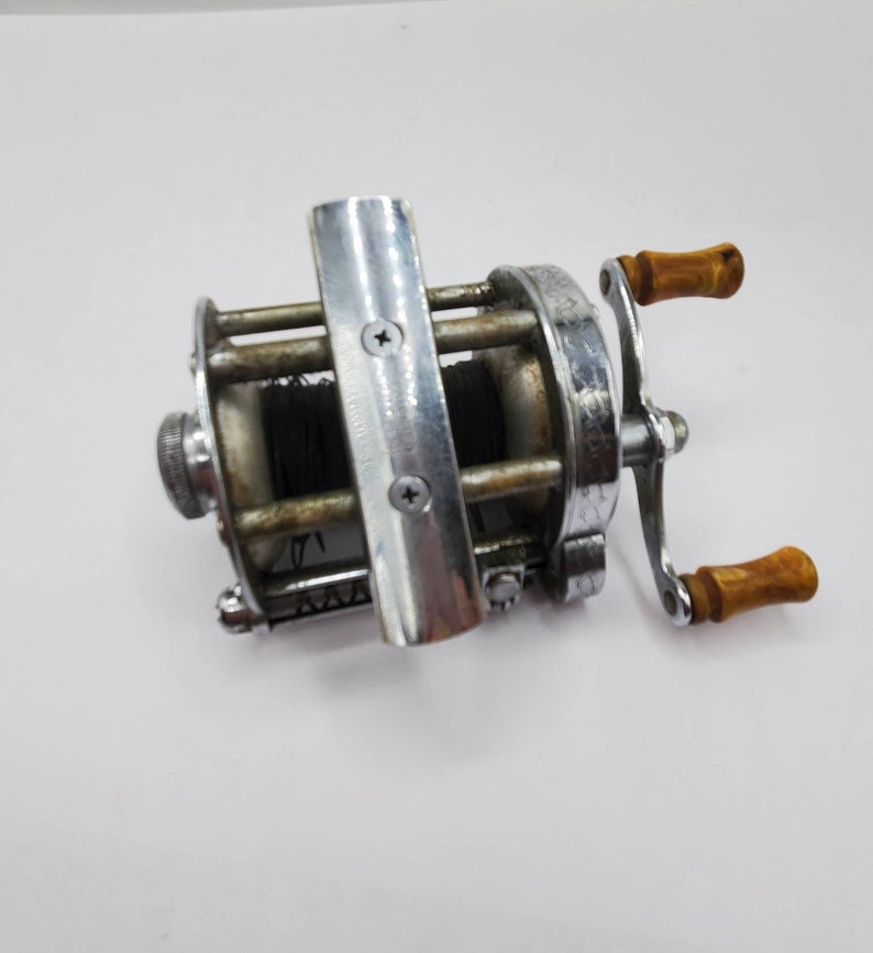 BOBINE DE PÊCHE vintage années 1950 Pflueger Skilkast 1953 niveau appât