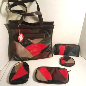 May include: A set of patchwork leather bags and accessories in various shapes and sizes. The set includes a tote bag, a wallet, a coin purse, and two additional pouches. The color palette features red, black, brown, and tan leather pieces.
