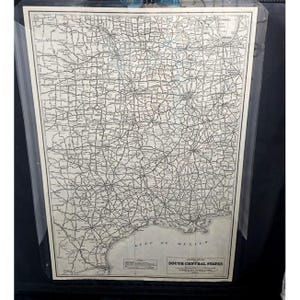May include: A vintage map of the South Central States of the United States. The map shows major highways and cities. The map is printed on a cream-colored paper and is framed in a clear plastic frame.