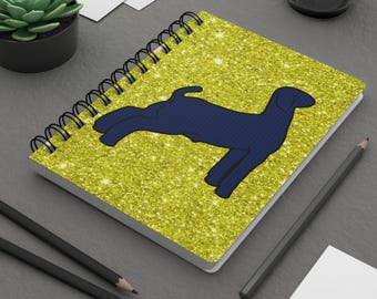Silueta de cabra de mercado, fondo brillante, cuaderno espiral, pana azul FFA