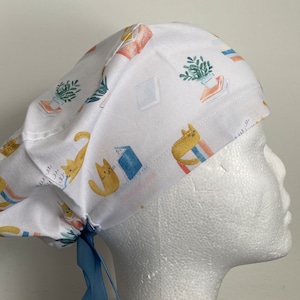 scrub hat-reading cats