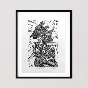May include: Black and white woodblock print of a traditional Javanese puppet, known as a wayang kulit, with intricate details and a dramatic pose. The print is framed and titled "Wayang Kulit".