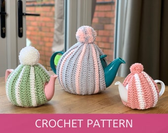 May include: Three crocheted teapot cosies in pink, green and grey with white stripes. Each cosy has a white pom-pom on top.  CROCHET PATTERN is written on the bottom of the image.